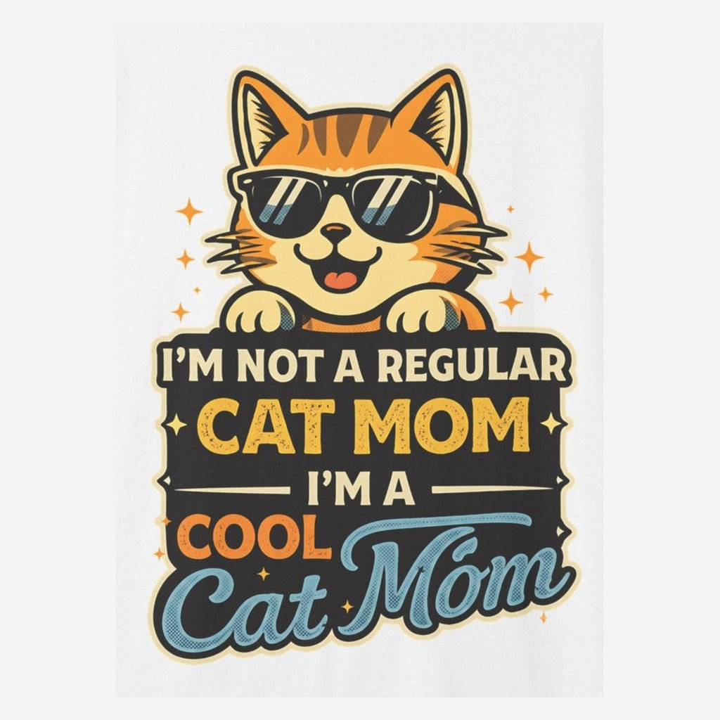 Close-up of the cool cat mom print: an orange tabby in black sunglasses over a sign reading I'M NOT A REGULAR CAT MOM I'M A COOL CAT MOM, on the White tee
